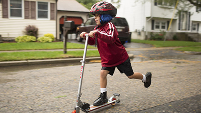 Kai on a scooter